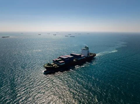 Large Container Ship Navigating Deep Blue Ocean Waters Near Si Racha Thaila.. Stock Photos
