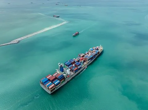 Large Container Ship Navigating Industrial Waters Near Laem Chabang Chon Bu.. Stock Photos