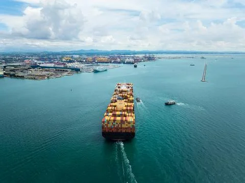 Large Container Ship Navigating Into Industrial Port Of Laem Chabang Thaila.. Stock Photos