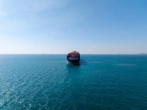 Large Container Ship Navigating Open Blue Waters In Si Racha Thailand Wide Sh Stock Photos