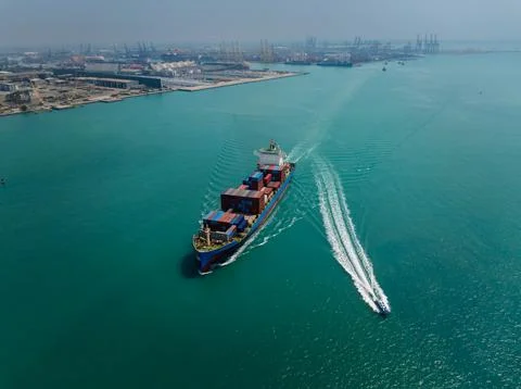 Large Container Ship Navigating Shipping Channel In Laem Chabang Harbor Wid.. Stock Photos