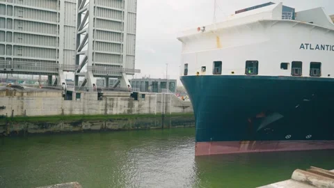 Large container ship passing Kieldrechtsluis lock in Antwerp port with raised Stock Footage 340935582