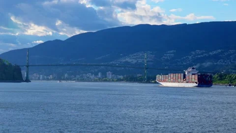 Large container ship is passing under the bridge in Vancouver, Canada, May 2021 Stock Footage 155037225