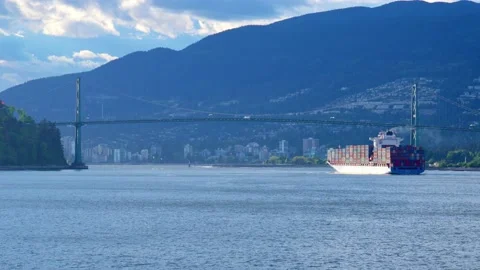 Large container ship is passing under the bridge in Vancouver, Canada, May 2021 Stock Footage 155037655