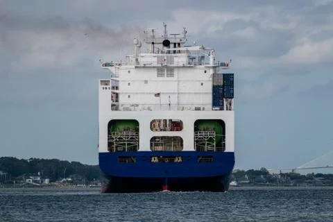 Large container ship in river. Stock Photos