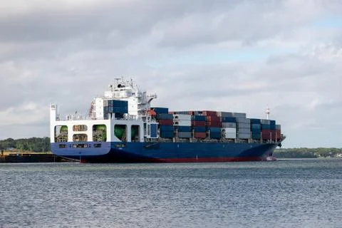 Large container ship in river. 库存照片