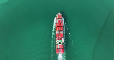 Large Container Ship Sailing Across Open Green Sea Waters Providing Global .. Video stock 336305697
