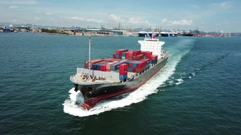 Large container ship at sea departing from wharf harbor port discharge cargo Stock Footage 336445602