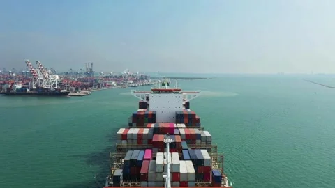 Large container ship at sea departing from wharf harbor port discharge cargo Stock Footage 336445930