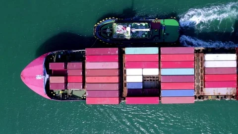 Large container ship at sea departing from wharf harbor port discharge cargo Stock Footage 336446176