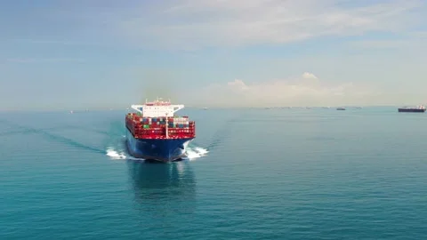 A large container ship for transporting goods near the port of Singapore. Stock Footage 134049401