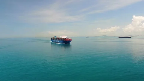 A large container ship for transporting goods near the port of Singapore. Stock Footage 134085553