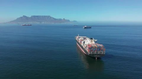 A large container ship for transporting goods near the port of Capetown, South Stock Footage 155017737