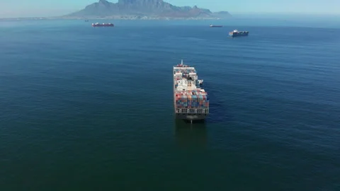 A large container ship for transporting goods near the port of Capetown, South Stock Footage 155789937