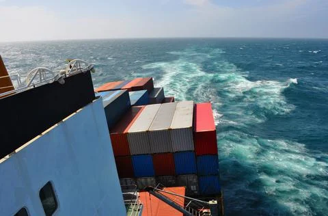 Large container vessel in ocean view from captain's bridge, pilot bridge. Lar Stock Photos