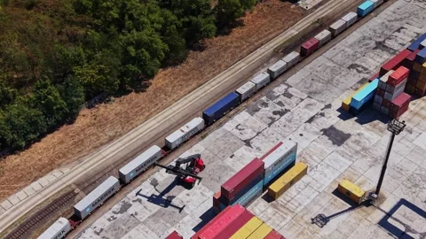 Large container yard with stacked containers and machinery in action Stock Footage 343118233