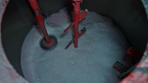 Large containers with stirred solution at the factory Stock Footage 239859991