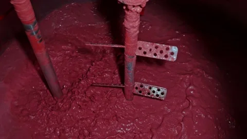 Large containers with stirred solution at the factory Stock Footage 239860102