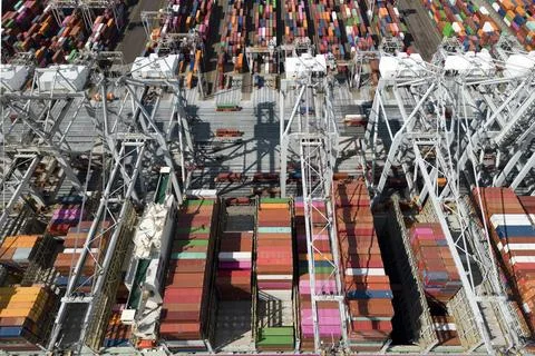 A large containership in a harbour Stock Photos
