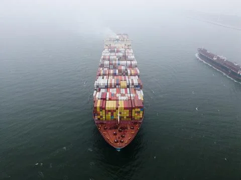 A large containership in a harbour Stock Photos
