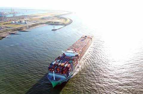 A large containership in a harbour Stock Photos