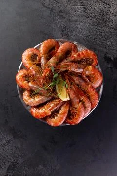 Large cooked shrimp on a dark background. Stock Photos