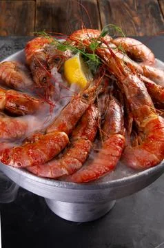 Large cooked shrimp on a dark background. Stock Photos