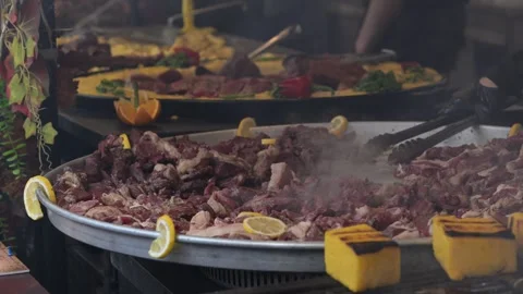 Large cooking pot with meat and vegetables at a market in Romania during the day Stock Footage 331224560