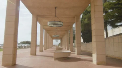 A large corridor of modern columns on a large square, with large chandeliers Stock Footage 221270422