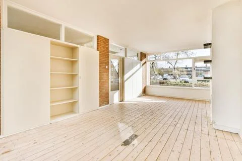Large cozy empty room with window Stock Photos