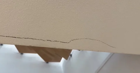 Large Crack in Interior Wall Above Staircase Stock Footage 337759577