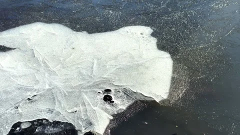 Large cracked ice sheet floating Stock Footage 330519661