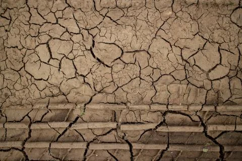 Large cracks in the ground. Abstract lines. Beautiful background. Nature. Stock Photos