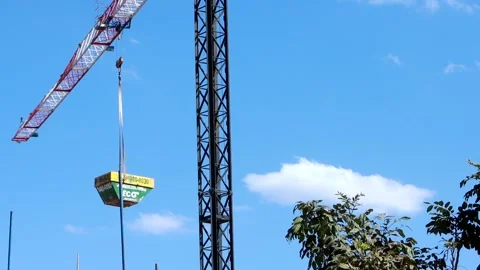 A Large crane being used for the construction of a new apartment building Vídeo Stock 245764583