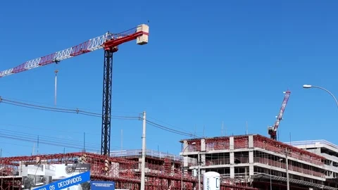 A Large crane being used for the construction of a new apartment building Stock Footage 245765017