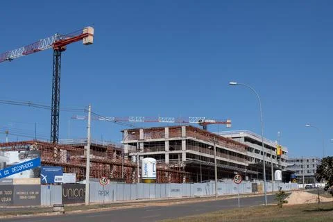 A Large crane being used for the construction of a new apartment building Stock Photos