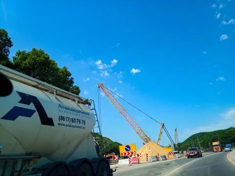 Large crane during the construction of the road. Stock Photos