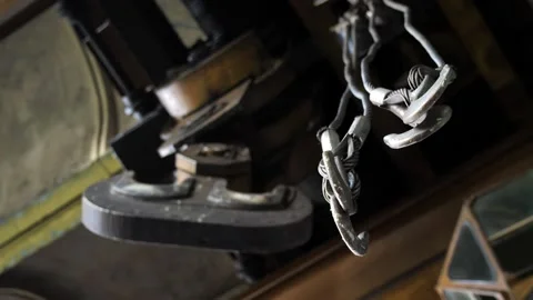 Large crane hooks hang in a large industrial hangar. Stock Footage 199139443