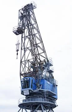 A large crane used in the harbor for loading Stock Photos
