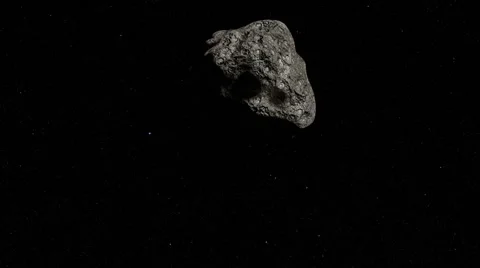 A large cratered asteroid flyby. Stock Footage 64278483
