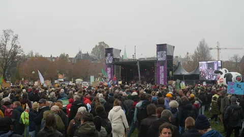 Large crowd and podium at Climate March. Amsterdam, Netherlands. Stock Footage 258042936