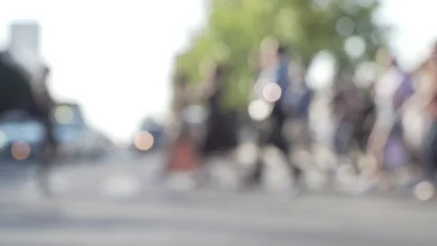 Large crowd of defocused pedestrians move along crosswalk Stock Footage 116987551