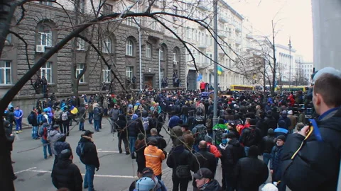 Large crowd of demonstrators gathered in small blocked street, public objection Stock Footage 85872745