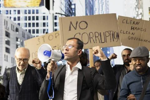 Large crowd of diverse protesters taking action against corrupt government Stock Photos
