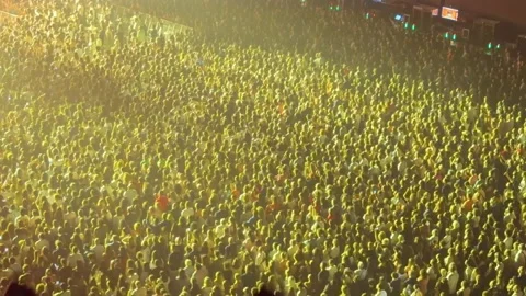 Large crowd enjoying concert with stage lights Stock Footage 337135637