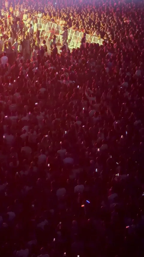 Large crowd enjoying concert with stage lights Stock Footage 337135650