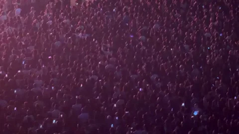 Large crowd enjoying concert with stage lights Stock Footage 337135660
