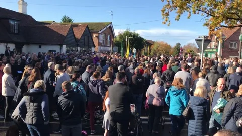 Large Crowd Gathering Outside The Old George Pub During Remembrance Day Parade Stock-Footage 346751180
