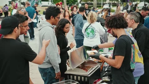 Large crowd gets food ay Day of the Dead Event Stock Footage 255748550