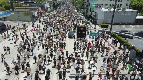 Large crowd marching down Los Angeles street for black lives Stock Footage 141140114